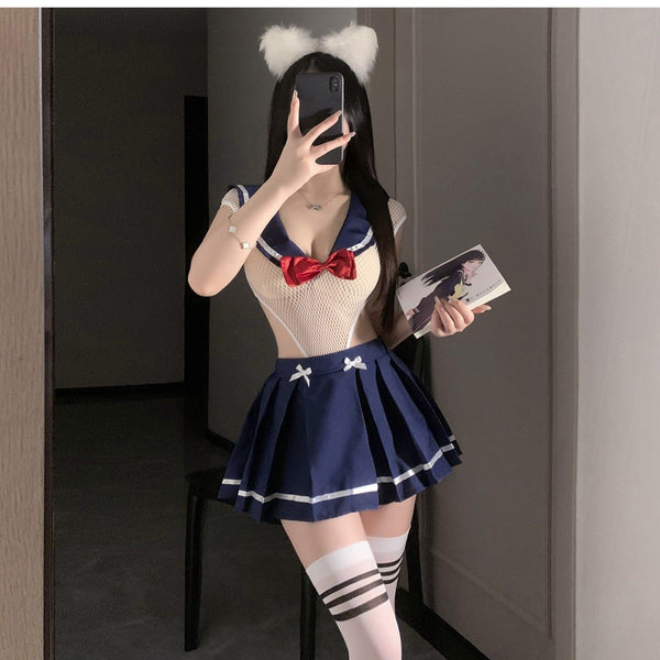 A basic blue pleated😍 skirt paired with a sheer top decorated with a red 🎀 bow in a sexy uniform style.
